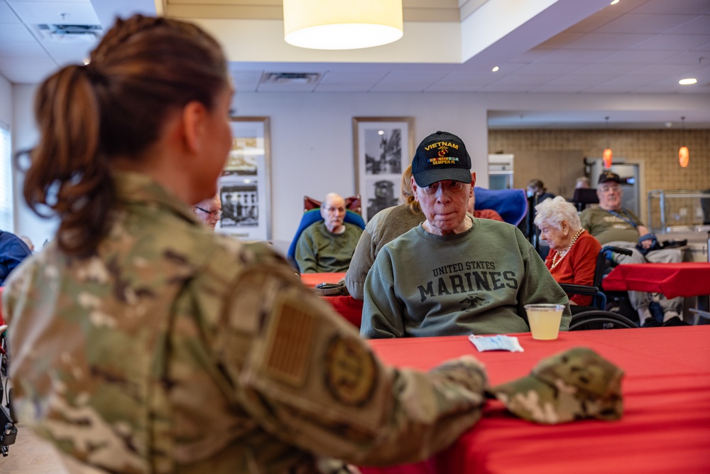 Airmen from the 109th Airlift Wing attend a lunch with veterans