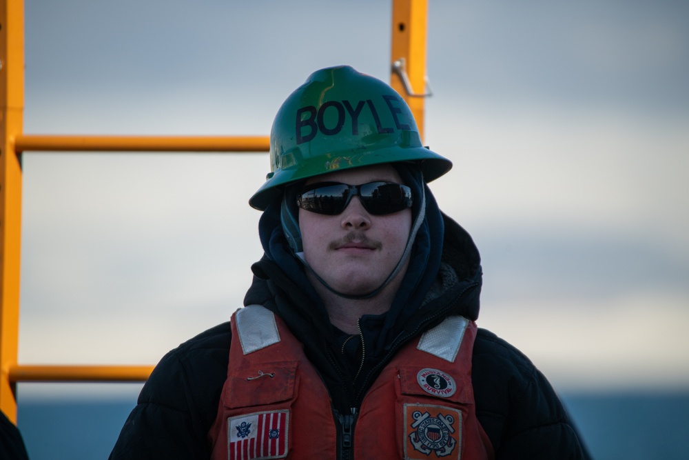 USCGC Polar Star (WAGB 10) conducts crane operations in McMurdo Sound during Operation Deep Freeze