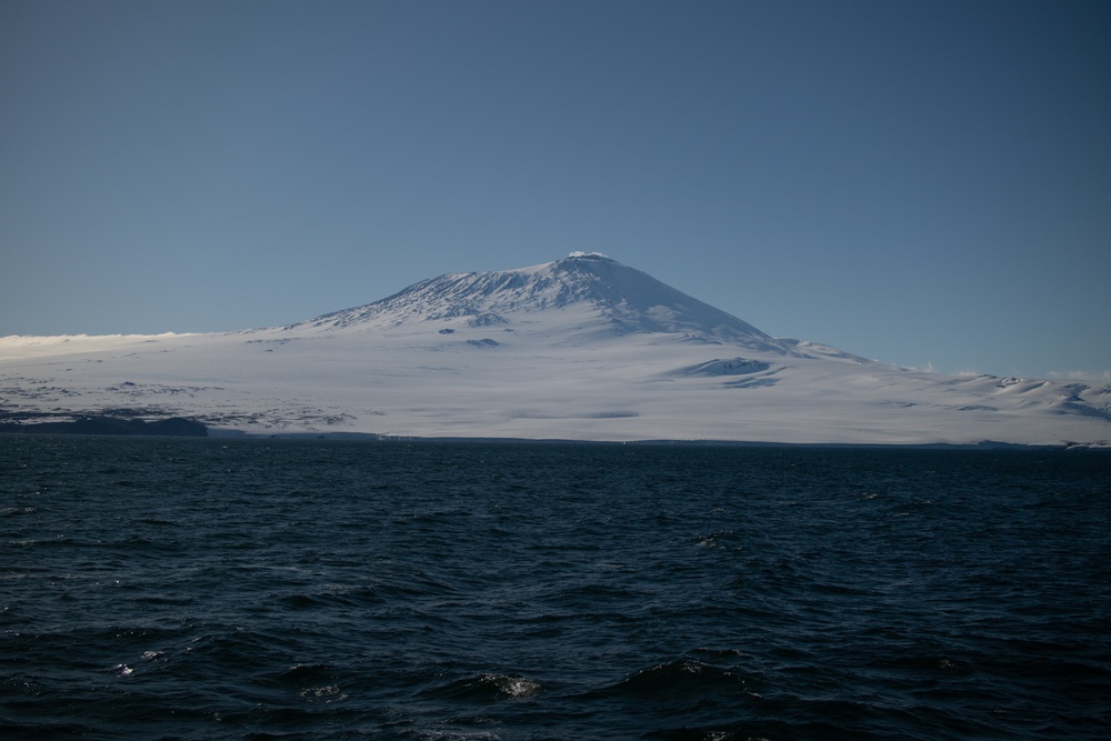 USCGC Polar Star (WAGB 10) conducts crane operations in McMurdo Sound during Operation Deep Freeze