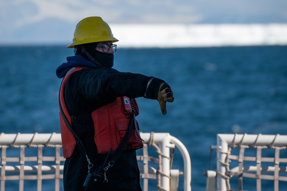 USCGC Polar Star (WAGB 10) conducts crane operations in McMurdo Sound during Operation Deep Freeze