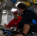 USCGC Polar Star (WAGB 10) crewmembers conduct damage control training in McMurdo Sound during Operation Deep Freeze