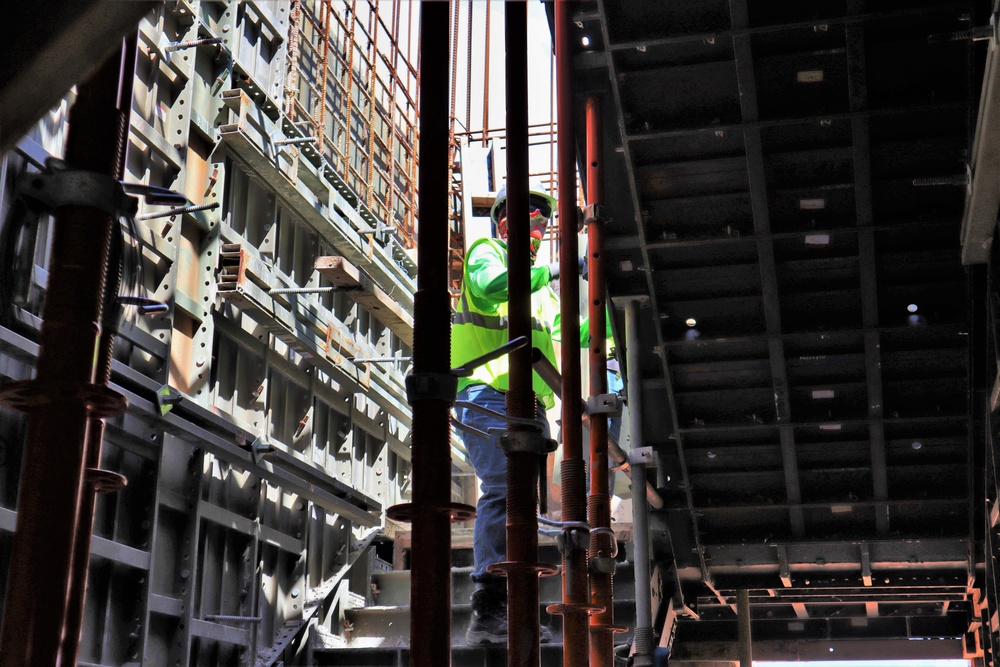 A Construction Worker Checks Progress on a Stairwell Under Construction on Marine Corps Base Camp Blaz