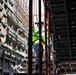 A Construction Worker Checks Progress on a Stairwell Under Construction on Marine Corps Base Camp Blaz