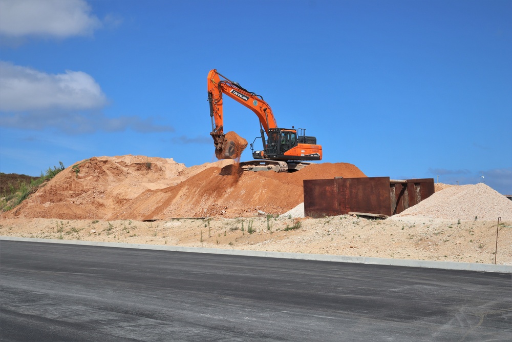 An Excavator Moves Soil During Construction on Marine Corps Base Camp Blaz