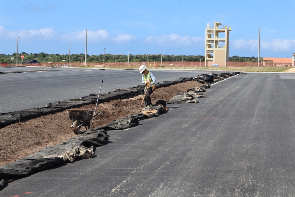 A Construction Worker Grades a Drainage Ditch for a New Parking Lot on Marine Corps Base Camp Blaz