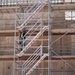 A Construction Worker Climbs Scaffolding as a Building Takes Shape on Camp Blaz