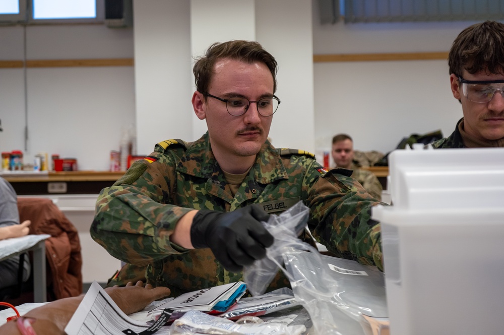 U.S. and German Soldiers conduct whole blood transfusion training in Germany