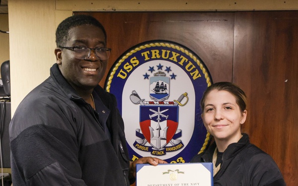 Lt. jg. Ray recieves a NAM