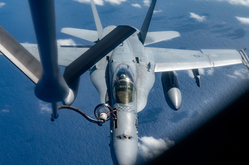 U.S. Air Force KC-135 refuels two U.S. Marine F/A-18s