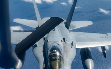 U.S. Air Force KC-135 refuels two U.S. Marine F/A-18s