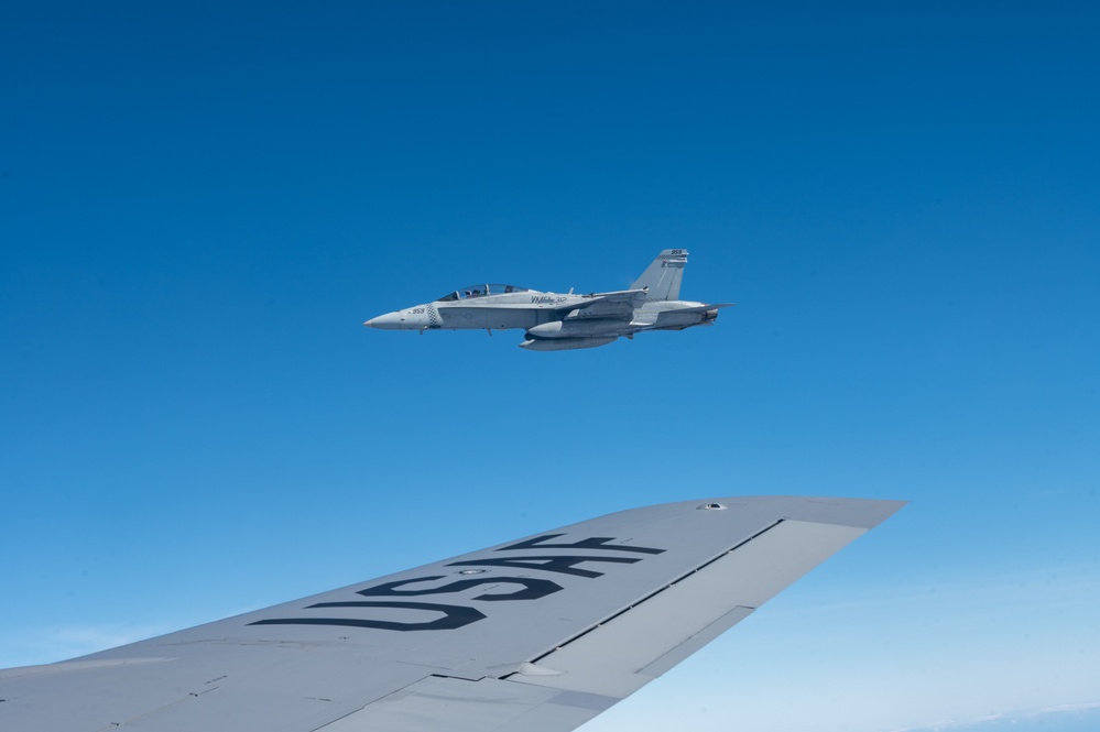 U.S. Air Force KC-135 refuels two U.S. Marine F/A-18s