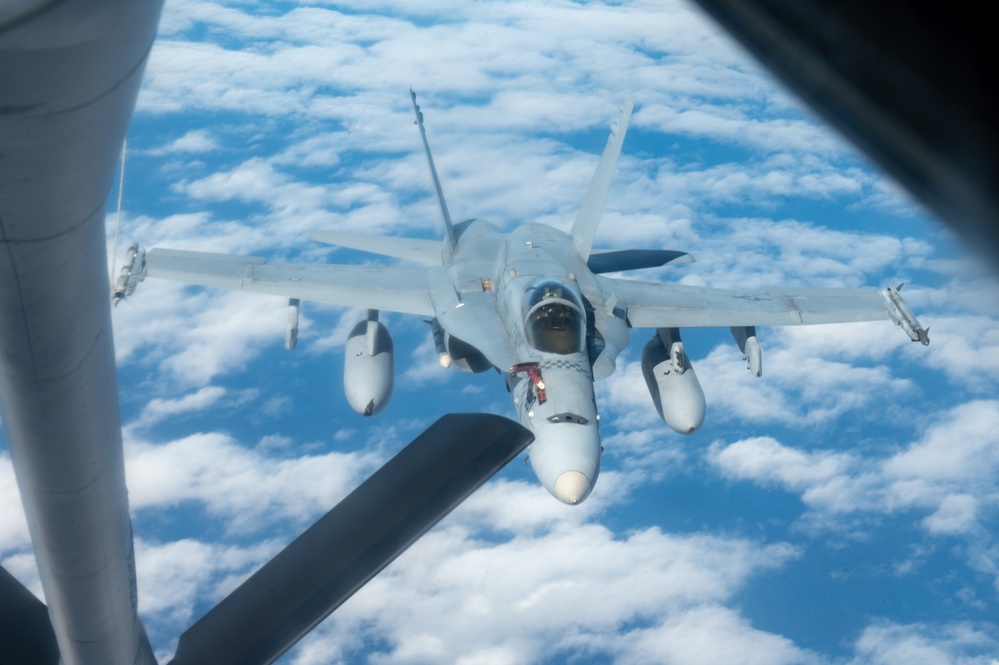 U.S. Air Force KC-135 refuels two U.S. Marine F/A-18s