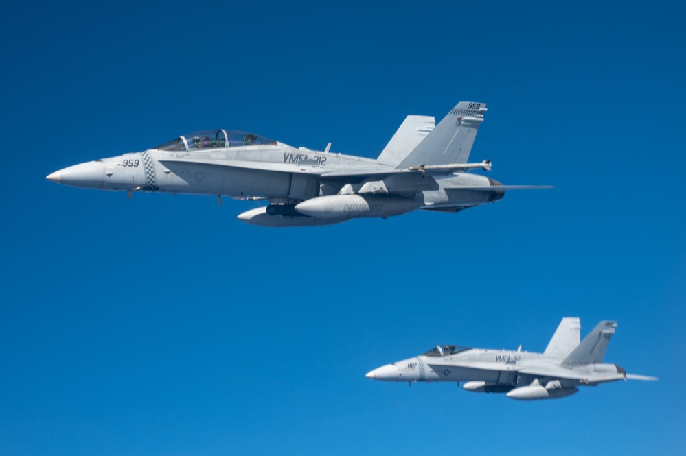 U.S. Air Force KC-135 refuels two U.S. Marine F/A-18s