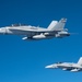 U.S. Air Force KC-135 refuels two U.S. Marine F/A-18s