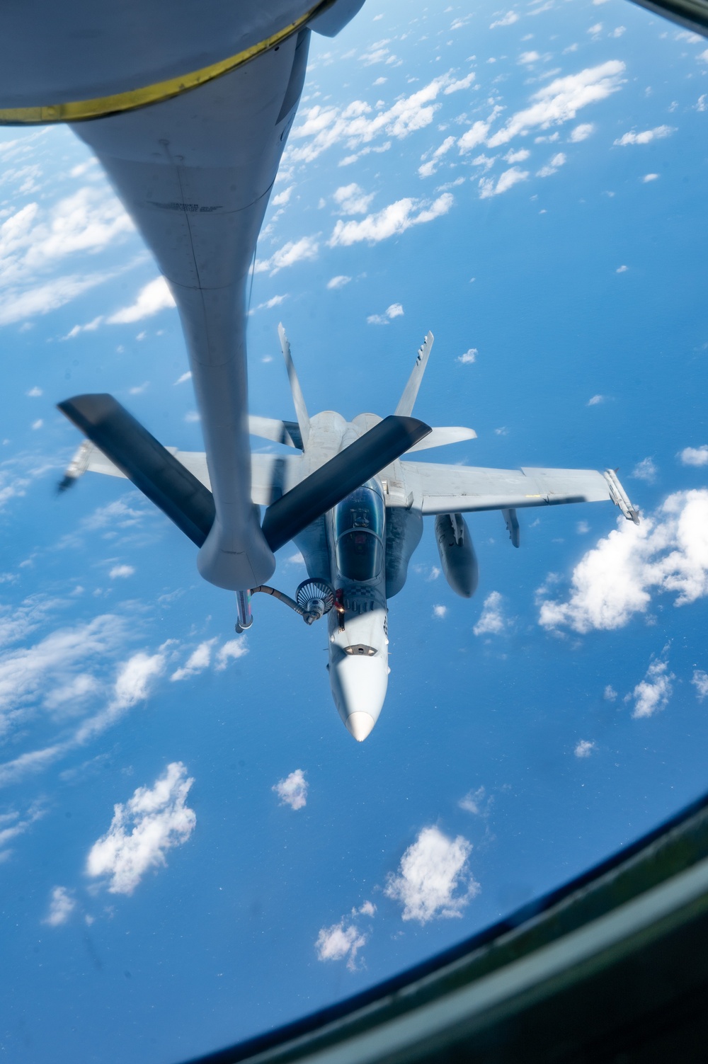 U.S. Air Force KC-135 refuels two U.S. Marine F/A-18s