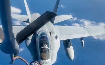 U.S. Air Force KC-135 refuels two U.S. Marine F/A-18s