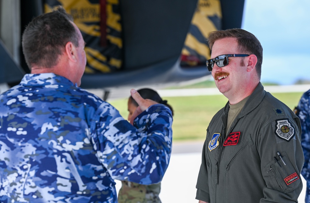 Distinguished visitors from Cope North 2025 visit 34th EBS B-1B Lancer during immersion tour