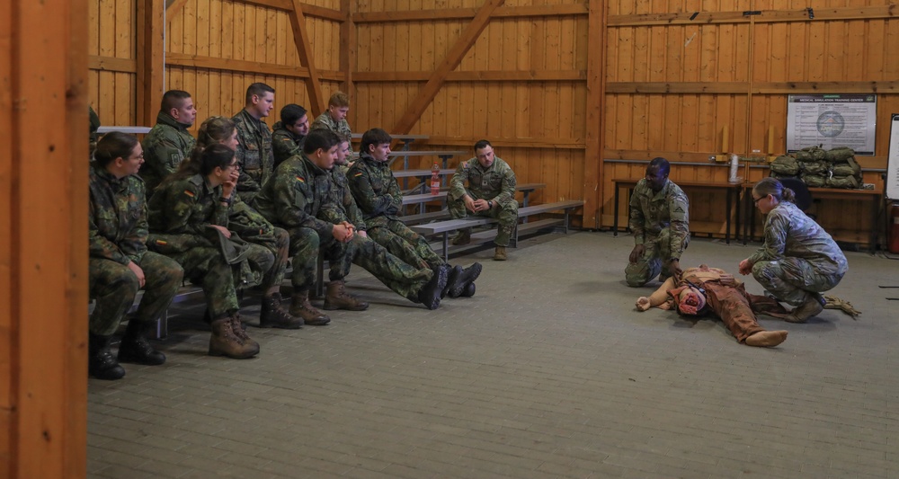 U.S. Army CATC and German Bundeswehr Medical Academy soldiers conduct trauma lane simulation exercise