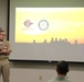 Rear Adm. Jeffrey Kilian speaks to SDSU students