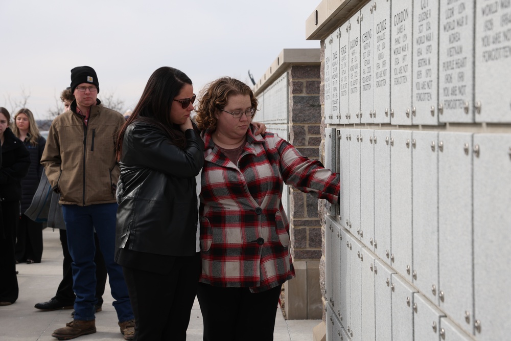 Loved ones pay respects at memorial