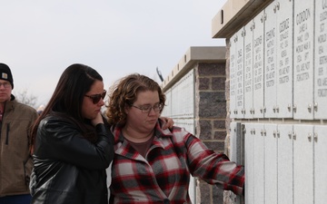 Loved ones pay respects at memorial