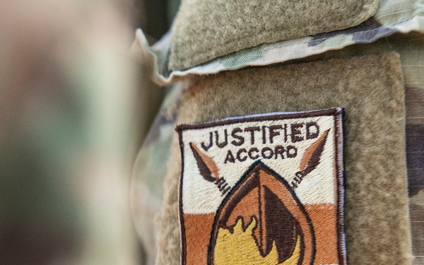 Multinational soldiers don the official exercise patch for Justified Accord 2025