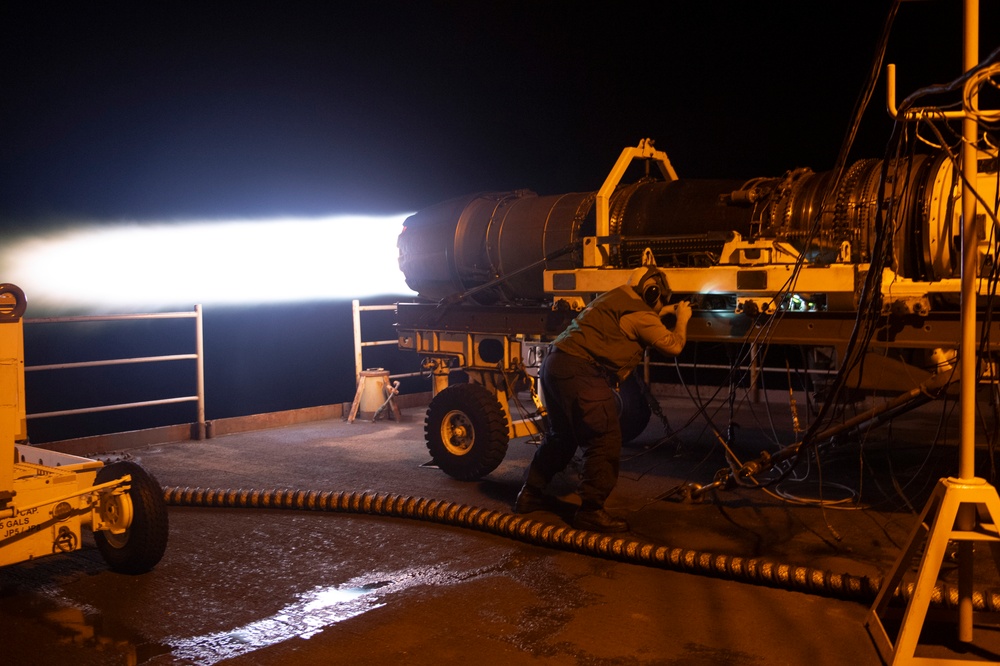 Nimitz Sailor Inspects a Jet Engine During a Runup