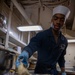 Nimitz Sailor Fills Baking Tray With Batter