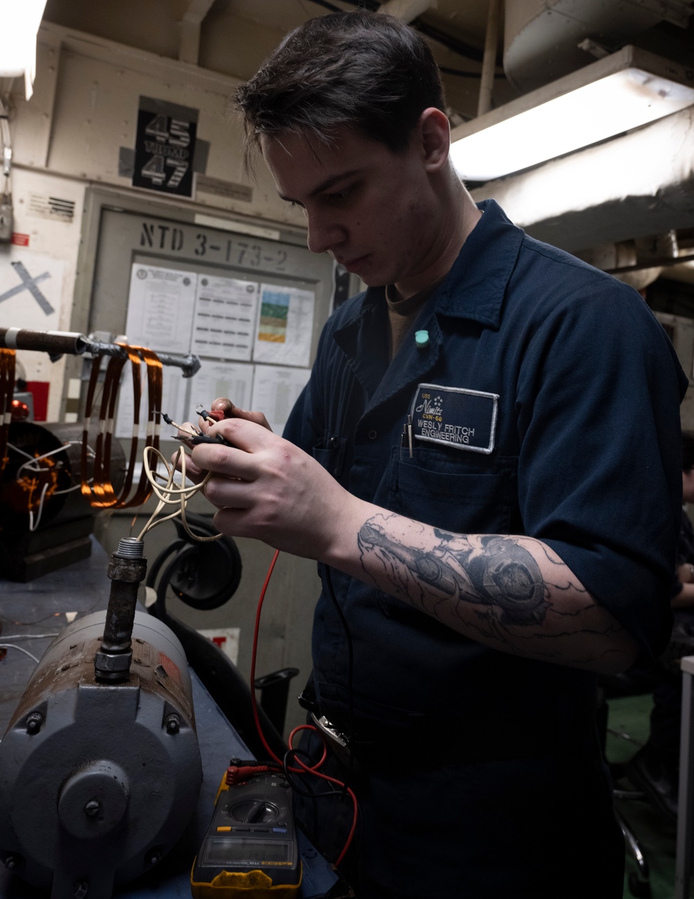 Nimitz Sailor Measures Phase To Phase Resistance on Air Conditioner Motor