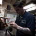 Nimitz Sailor Measures Phase To Phase Resistance on Air Conditioner Motor