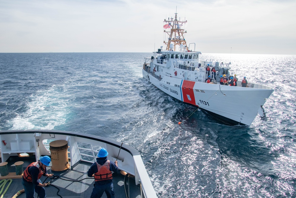 USCGC Active crewmembers conduct a towing and astern refueling exercise