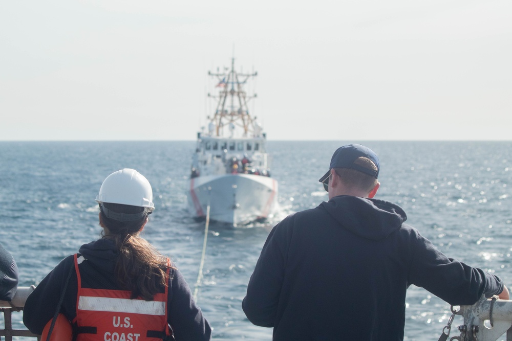 USCGC Active crewmembers conduct a towing and astern refueling exercise