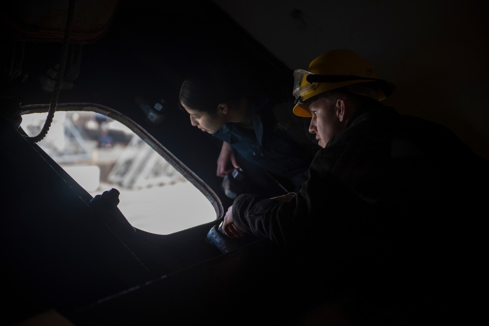 Nimitz Sailors Monitor a Line Going to the Pier