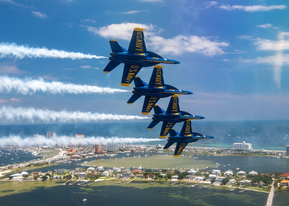 The Navy Flight Demonstration Squadron, the Blue Angels, perform in Pensacola Beach, FL.