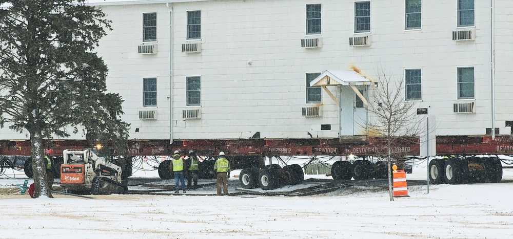 Workers successfully move second World War II barracks at Fort McCoy; preparations under way to move third building