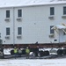 Workers successfully move second World War II barracks at Fort McCoy; preparations under way to move third building