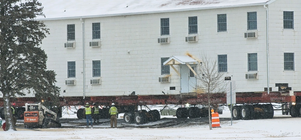 Workers successfully move second World War II barracks at Fort McCoy; preparations under way to move third building