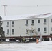 Workers successfully move second World War II barracks at Fort McCoy; preparations under way to move third building