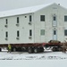 Workers successfully move second World War II barracks at Fort McCoy; preparations under way to move third building