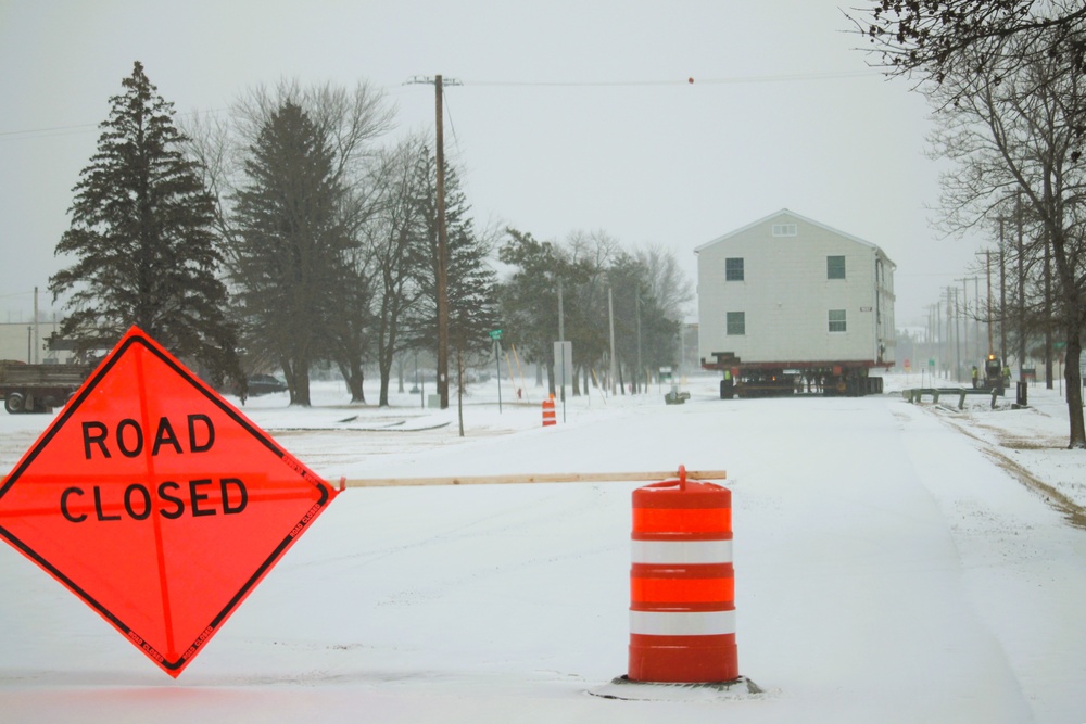 Workers successfully move second World War II barracks at Fort McCoy; preparations under way to move third building