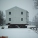 Workers successfully move second World War II barracks at Fort McCoy; preparations under way to move third building