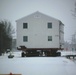 Workers successfully move second World War II barracks at Fort McCoy; preparations under way to move third building