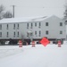 Workers successfully move second World War II barracks at Fort McCoy; preparations under way to move third building