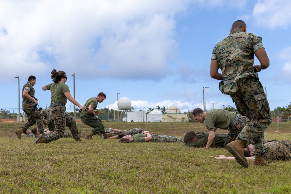 U.S. Marines simulate aiding casualties during Cope North 25