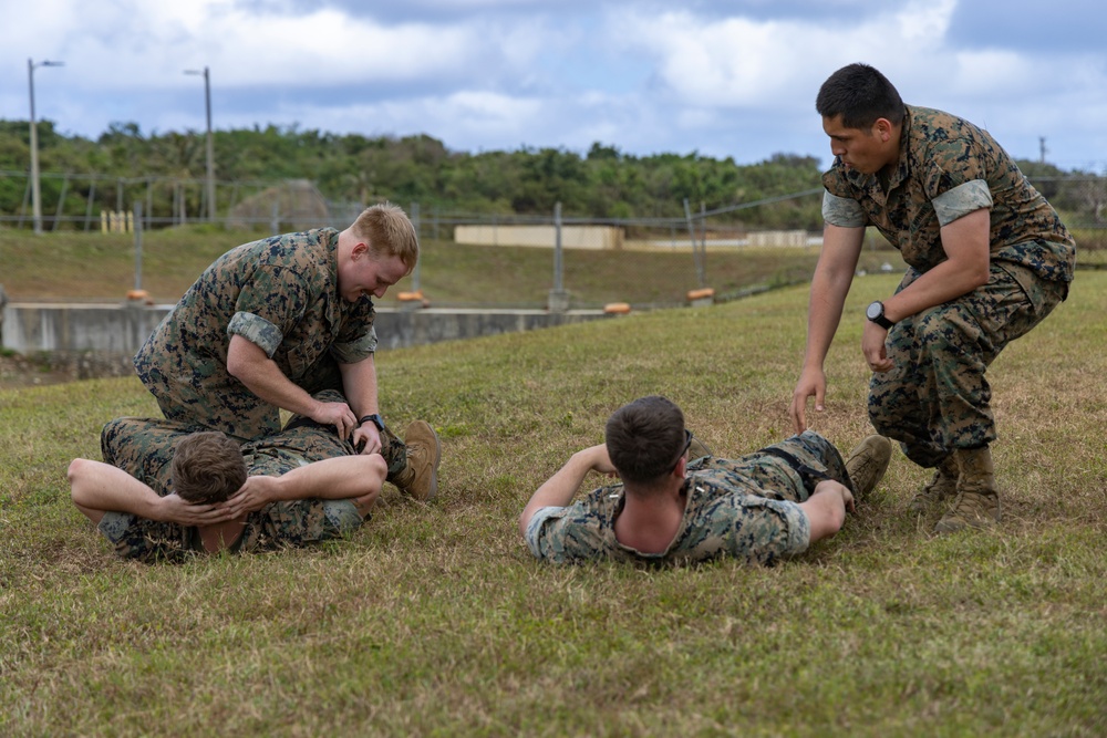 U.S. Marines simulate aiding casualties during Cope North 25