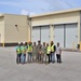 Contractors, Marines, and OICC MCM Staff Pose in Front of a Newly Completed Building on Marine Corps Base Camp Blaz