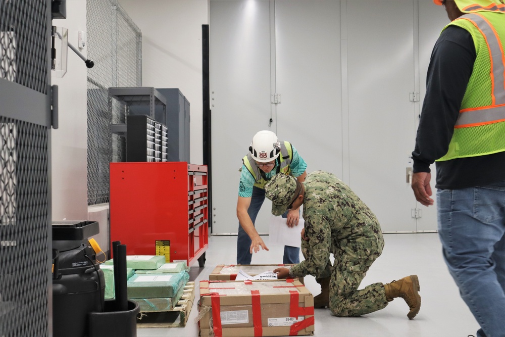 OICC MCM Staff Sign Closeout Documents for the Newly-Finished EOD Building on Marine Corps Base Camp Blaz