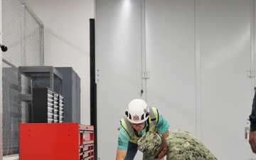 OICC MCM Staff Sign Closeout Documents for the Newly-Finished EOD Building on Marine Corps Base Camp Blaz