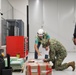 OICC MCM Staff Sign Closeout Documents for the Newly-Finished EOD Building on Marine Corps Base Camp Blaz