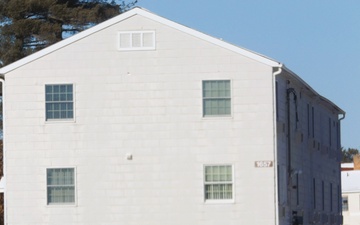 Workers successfully move second World War II barracks at Fort McCoy; preparations under way to move third building